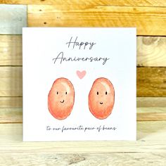 an anniversary card with two oranges on it