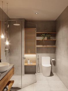 a bathroom with a toilet, sink and shower