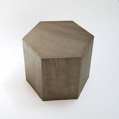 a wooden box sitting on top of a white surface