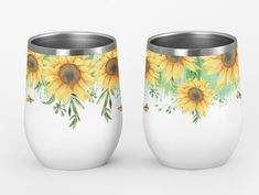 two white cups with sunflowers painted on them