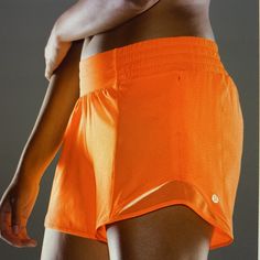 Built-In Liner With Stash Pocket, Zippered Pocket Inseam, Reflective Detail And Drawstring To Cinch Waist In Neon Orange Color - Size 4 Tall Lightweight Yoga Athletic Shorts, Orange Athleisure Activewear With Built-in Shorts, Yoga Athletic Shorts With Go-dry, Orange Stretch Training Shorts, Orange Athleisure Athletic Shorts With Built-in Shorts, Breathable Orange Sports Bottoms, Moisture-wicking Orange Shorts For Gym, Lightweight Athleisure Sports Shorts, Moisture-wicking Orange Gym Shorts