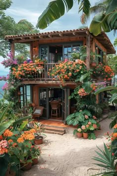 a house with flowers on the balconies and plants in pots growing out of it