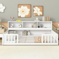 a baby's room with two white cribs in it