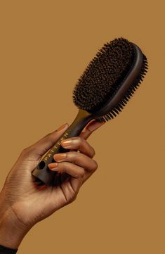 What it is: A double-sided Bristle Brush that polishes and refines strands.Who it's for: Ideal for curly, coily and tight hair textures.What it does: The 2-in-1 brush features nylon bristles to finesse flyaways and boar bristles to stick tighter styles. The lightweight brush gently polishes and refines strands. How to use: Use the brush on wet or dry hair to smooth hairstyles. Use as desired. 2.95" x 1.77" x 8.66" Premium boar bristles/nylon fibers/ABS/rubber Imported Curly Brush, Smooth Hairstyles, Smoothing Brush, Curly Hair Brush, Best Hair Brush, Pattern Beauty, Black Hair Updo Hairstyles, Round Hair Brush, Boar Bristle Brush