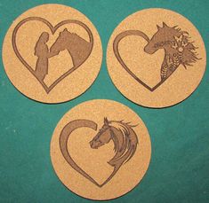 three wooden coasters with horses and heart shapes