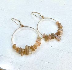 Gorgeous natural ivory brown moon stones and freshwater pearl in 14k gold filled or sterling silver hoops. Gold plated and silver plated hoops options available. These all natural earrings are perfect for boho outfits, beach outfits, weddings, and bridesmaid gifts. Can be made with or without pearls. See options. Hoops size 30mm- medium 💜Simple, Dainty and Elegant Raw Natural Stone for everyday wear. High quality comfortable pieces at an affordable price! Simple yet elegant especially the shine 14k Gold Filled Gemstone Hoop Earrings, Bohemian Dangle Hoop Earrings In 14k Gold Filled, Bohemian 14k Gold Filled Dangle Hoop Earrings, Small Bohemian 14k Gold Filled Hoop Earrings, Small Hoop Earrings With Natural Stones For Everyday, Small Hoop Earrings With Natural Stones, Everyday Small Hoop Earrings With Natural Stones, Hoop Earrings With Natural Stones In 14k Gold Filled, Boho Hoop Earrings