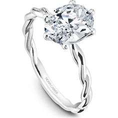 a white gold engagement ring with an oval cut diamond in the center and twisted band