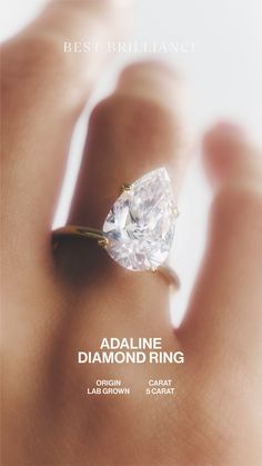 a woman's hand holding a diamond ring with the words best brilliantance on it