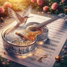 a musical instrument with a hummingbird on it and sheet music in the foreground