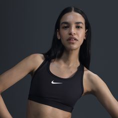 You're on the move. Your padding shouldn't be. This Swoosh bra's sewn-in pads stay in place so you can work hard without worrying about them shifting or folding. Great for training workouts and dance classes, medium support gives you a snug hold that helps keep everything in place. Plus, sweat-wicking, adaptive material quickly recovers its shape so you can stay comfortable throughout your workout. Black Nike Sports Bra Outfit, Nike Sports Bra Outfit, Nike Sports Bras, Nike Athletes, Nike Bra, Sports Bra Outfit, Sports Bra Nike, Bra Sewing, Training Workouts