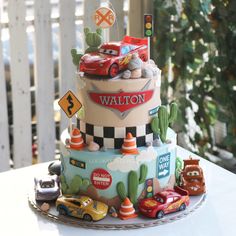 a birthday cake with cars and traffic signs on it