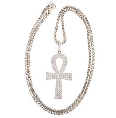 18K White Gold Ankh Diamond Pendant Specifications: Main Stone: 118 Round Diamonds, TW 5.30 carat H/SI1Weight: 23.2g Price: $10,995 - CALL US TO ORDER 504-908-0011 CHAIN NOT INCLUDED Diamonds are the birthstone for April and symbolizes innocence and constancy along with eternity and love. For that absolutely dazzling effect, purchase one of our stunning diamond pieces and let yourself shine on the outside as you do on the inside. Diamonds are the only thing that last a lifetime and can represent Diamond Pendant, Round Diamonds, White Gold, Pendant Necklace, Chain, Stone, Pendant, 10 Things