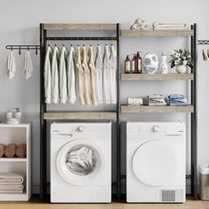 a washer and dryer sitting next to each other in front of a drying rack