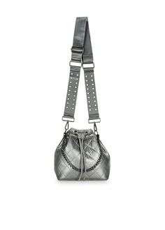 The perfect on the go companion, the Lindsey Iron Puffer Bucket Bag offers stylish construction that keeps you organized when out and about. Puffer bucket bag with pewter leatherette quilted exterior. Additional removable wristlet pouch. Features a short handle strap, adjustable crossbody pewter strap w/gunmetal studs, and a gunmetal chain strap. Dimensions 9.8 x 8.6 x 5.5 inches. Washable with mild soap. Hang dry. Versatile Silver Bag For Daily Use, Silver Shoulder Bag With Removable Pouch For On-the-go, Travel Bucket Bag With Gunmetal Hardware Crossbody, Versatile Silver Bag For Everyday, Travel Bucket Bag With Gunmetal Hardware And Crossbody Shape, Travel Bucket Bag With Gunmetal Hardware, Silver Shoulder Bag With Adjustable Strap For On-the-go, Rectangular Travel Bucket Bag With Silver-tone Hardware, Versatile Silver Travel Bags