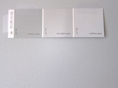 three different shades of white paint on a wall with the same color swatches for each one