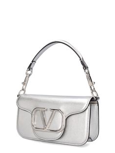 Find VALENTINO Locò Top Handle Bag on Editorialist. The VALENTINO GARAVANI Locò Top Handle Bag features a metal chain strap, a detachable leather top handle, and a front flap closure with a metal logo detail. The bag measures 11cm in height, 20cm in width, and 5cm in depth. The strap drop is 51cm and the handle drop is 11cm. Ski Accessories, Beige Style, Valentino Bags, Sports Accessories, Metal Logo, Heeled Loafers, Metallic Logo, Handle Bag, Leather Top