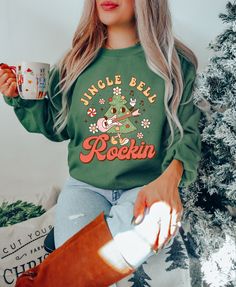 Jingle Bell Rockin Sweatshirt - Christmas Tree Sweater - Music Lover Christmas Shirt - Christmas Music Hoodie - Funny Christmas Shirt How can I order? 1️) Please review all the information provided before placing an order 2️) Select the shirt type and size. 3️) Select the color of the shirt using the following options. 4️) Please add the vinyl color (white or black) in the optional message section of the order. 5️) Need more Items? Add the current item in the cart. And If you like to add more items to your order please press the back button and repeat steps 1-4 again. 6️) Once all your desired items are in your cart you may complete your order by entering your payment method, desired shipping address and click submit. When will my product arrive? Processing Time: 1-3 days During holidays p Casual Christmas Cotton Sweatshirt, Casual Cotton Christmas Sweatshirt, Casual Christmas Hoodie With Crew Neck, Casual Crew Neck Hoodie For Holiday, Casual Green Holiday Sweatshirt, Casual Green Sweatshirt For Holidays, Casual Green Christmas Sweatshirt, Casual Christmas Cotton Hoodie, Casual Cotton Christmas Hoodie