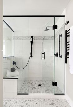 a walk in shower sitting next to a bathroom sink