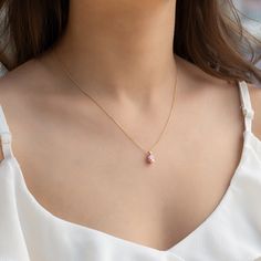 Pink stone pear cut zircon; with 14k real gold. This necklace will be symbol of your love. *Free Express International Shipping NEXT BUSINESS DAY SHIPPING! PRODUCT DETAILS *The product is made of 100% 14k Solid Gold and it has a 14K or 585 stamp on item. (I don't sell filled or plated jewelry) *The package includes a gold certificate.  *The product includes 14K solid gold chain. *Every package comes in a gift box. *14K gold indicates that the product is produced from 58% pure gold. *The product is yellow gold. *Stone measures: 10mmx6mm *       Made in Türkiye. There are earrings match for this model. Please click the link below: https://www.etsy.com/listing/1419600592/pink-stone-stud-earrings-14k-yellow ABOUT SHIPPING We ship all packages safely with EXPRESS SHIPPING. Estimated shipping ti Pear-shaped Pearl Pendant Necklace As Gift, Pear-shaped Cubic Zirconia Necklace Gift, Rose Gold Pear Necklace For Gift, Rose Gold Necklace For Gift, Rose Gold Pear Shaped Necklace Gift, Rose Gold Pear-shaped Necklace For Gift, Necklace Princess, Pink Stone Necklace, Gold Certificate