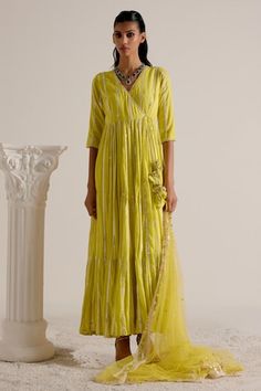 Neon green tiered angarkha featuring thread and mirror embellishment with tassel detailing in the front. Comes with a sheer mirror and thread embellished dupatta. - Aza Fashions Festive Green Kurta With Tassels, Designer Anarkali Set For Navratri With Tassels, Designer Anarkali Set With Tassels For Diwali, Navratri Designer Anarkali Set With Tassels, Bollywood Green Sets With Tassels, Green Bollywood Sets With Tassels, Festive Green Dress With Tassels, Festive Green Tassel Dress, Designer Anarkali Set With Tassels