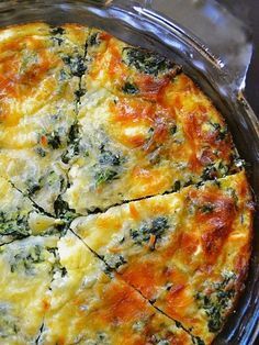 a quiche with spinach and cheese is shown in a casserole dish