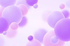 many balls are floating in the air on a white surface with pink and purple hues