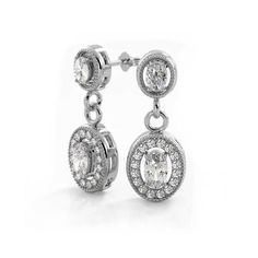 Indulge in timeless elegance with our Vintage Inspired Oval and Round Diamond Drop Earrings. The delicate oval and round diamonds sparkle in any light, while the classic drop style and intricate milgrain details add a touch of vintage charm. Handcrafted in NYC for a truly one-of-a-kind piece. Elegant Bridal Earrings With Brilliant Cut In Oval Shape, Elegant Oval Brilliant Cut Bridal Earrings, Elegant Oval Bridal Earrings With Brilliant Cut, Oval Diamond Earrings With Elegant Design For Formal Occasions, Elegant Oval Diamond Earrings For Formal Occasions, Formal Oval Bridal Earrings With Brilliant Cut, Classic Oval Halo Earrings, Classic Oval Bridal Earrings With Brilliant Cut, Timeless Oval Halo Diamond Earrings