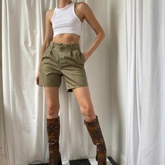 Amazing 90s vintage khaki / Sage / Olive tailored high waisted city shorts. Boy / Bermuda style. Khaki green cotton shorts with with zip fastening, belt hoops, side pockets and pin tucked pleat front detail. Buttoned back pockets. seen on a size 8 (5ft9) would be more relaxed on smaller sizes. Laidback preppy utility city style, perfect with an oversized blazer. These are in great condition. Multiple sizes available. Model is wearing a size UK 12 in pictures. Model size: UK 10 5ft9. Measurements Cheap Khaki Cargo Shorts With Belt Loops, Safari Shorts Outfit, High-waisted Khaki Shorts For Work, Khaki Workwear Shorts, Vintage Cotton Khaki Shorts, Khaki Shorts For Workwear In Spring, Khaki Shorts For Workwear, Spring High-waisted Cargo Shorts For Work, Fitted Spring Cargo Shorts