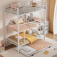 a bunk bed with two sets of mattresses on the bottom and one set up above it