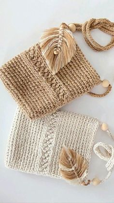 two crocheted bags sitting on top of each other next to string and beads