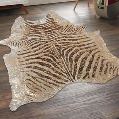 a zebra print rug on the floor in a living room