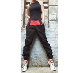 Sport elegant black red pants🤩 Extravagant designs and high quality fabrics. The item from the pictures is size S  For more information feel free to ask questions. Material &Care  Cotton textiles  Machine wash 30oC Hand wash at low temperatures Do not machine dry Medium hot iron Sizing  We make sizes from xs to 5xl as well as customized measures.So don't hesitate to contact us and make one for you. 🛫🎁Shipping🎁 🛬 STANDARD SHIPPING   Europe : 6-8 business days USA&Canada : 8-10 business days Everywhere else :10-20 business days DHL EXPRESS SHIPPING Europe: 2-3 business days USA & Canada: 2-3 business days Everywhere else: 3-6 business days We are glad that you choose our shop. XS (US 2, UK 6) Bust: around 33.5" / 85 cm Waist :around 26" / 66 cm Hips: around 36" / 91 cm Height: 5'3" / 16 Black Fitted High-waisted Parachute Pants, Stretch Cotton Punk Pants, Red Casual Bottoms For Alternative Fashion, Casual Red Bottoms For Alternative Fashion, High Waist Red Cotton Harem Pants, Black Cotton Pants For Alternative Fashion, Red High Waist Cotton Harem Pants, Red Punk Style Pants For Streetwear, Red Punk Pants For Streetwear