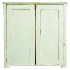 an old green painted cabinet with two doors