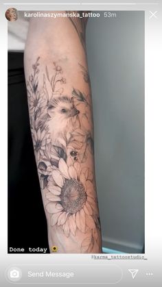 a woman's arm with flowers on it