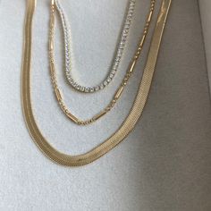 Simple and elegant in design, this gold filled necklace is a perfect addition for someone looking for a dainty gold necklace to add to their daily rotation. Pair with a pendant, beaded necklace, or STACK with the essential stack. Gold Plated Beaded Chain Necklace, Elegant Gold Layered Necklace With Beaded Chain, Dainty Jewelry With Beaded Chain For Layering, Minimalist Gold Plated Double Chain Charm Necklace, Elegant Beaded Necklaces With Adjustable Chain For Layering, Dainty Beaded Chain Jewelry For Layering, Gold Jewelry With Beaded Chain For Layering, Dainty Beaded Chain Layered Necklace, Elegant Gold Crystal Necklaces For Layering