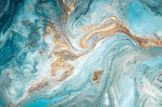 an abstract blue and gold marble background