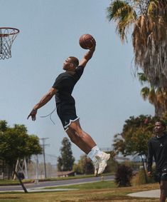 a man jumping in the air to dunk a basketball