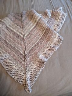 "A lovely triangle shawl that is knit by my mother. Super warm and thick. Wrap it around your shoulders to stay warm or roll it up and use it as a thick scarf. Wonderful to keep you warm in the bitter cold of winter. The yarn used is acrylic and the measurements are 55\" wide and 28\" long.  The colors are light purple, light lavender, purple gray and grayish pink.  Very warm and not itchy.  Hope you enjoy." Grayish Pink, Thick Scarf, Triangle Shawl, Triangle Shawls, Light Lavender, Purple Light, Lavender Purple, Purple Gray, Purple Grey