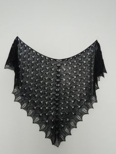 "Intricately designed shawl/wrap made from  lace weight alpaca-merino-nylon yarn.  Incredibly light as feather yet very warm.  It has deep navy blue color, though it might look black on the computer screen. Measurements: 48\" wide, 30\" deep   Perfect gift to yourself or to loved one. Yarn content: 60% Baby Alpaca, 25% merino wool, 15% Nylon Care: hand wash in a cool water with a liquid for delicate garments, lay flat to dry, if you wish to keep pointy edges block them by pinning  Contact me with any questions, I will be happy to help out! Thank you" Black Knitted Shawl, Crow Wing Shawl, Hand Knitted Alpaca Shawl, One Size Black Knitted Shawl, Handmade Black Bohemian Shawl, Crow Feather Shawl, Elegant Hand Knitted Alpaca Shawl, Dove Wing, Hand Knitted Blue Winter Shawl