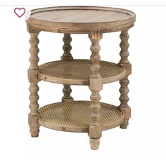 a round wooden table with two tiered shelves