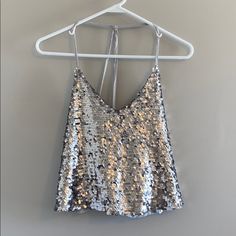 Nwt Silver Sequined Crop Tank Armpit To Armpit: 17” Shoulder To Hem: 19.5” Pet And Smoke Free Home All Measurements Are Approximate Silver Fitted Tank Top For Party Season, Silver Crop Top For Summer Party, Glamorous Silver Tank Top For Party, Glamorous Silver Party Tank Top, Fitted Silver Tank Top For Summer, Silver Sleeveless Crop Top For Night Out, Silver Sequined Tank Top For Night Out, Sequined Silver Tank Top For Night Out, Sequin Silver Tank Top For Night Out