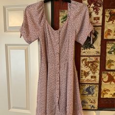 This Is A Mauve/Dusty Purplish Pink Floral Sienna Sky Dress. Small White Flowers And Green Leaves On It, Faux Fabric Covered Buttons Down The Front. Bought It A Couple Years Ago And Just Never Wore It. Size Small And No Stains/Tears. Great For Spring, Summer, Or Fall. Please Message Me With Any Questions And I Can Also Post Measurements If Needed! Also Message Before Buying As This Is Cross Posted! Cottagecore, Prairie, Vintage, Milkmaid, Puff Sleeve, Forever 21, Urban Outfitters, Zara, American Sky Dress, Small White Flowers, Fabric Covered Button, Fabric Covered, Covered Buttons, Green Leaves, Pink Floral, White Flowers, Pink Purple