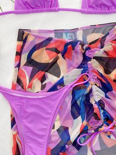 Halterneck Triangles Split Bikini Swimsuit+Coloful Cover-Up Three-Piece Set Purple One-piece Swimwear For Vacation, Purple One-piece Swimwear For Beach, Multicolor One-piece Tankini Beachwear, Multicolor One-piece Tankini For Beach Party, Purple Beachy Swimwear For Summer, Beachy Purple Swimwear For Summer, Multicolor Tankini For Beach Party, Summer Purple Swimwear For Sunbathing, Purple Swimwear For Sunbathing In Summer