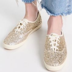 Keds Champion Glitter Celebrations Sneakers Gold Size 9.5 Brand New! The Are Much More Gold In Actual Than In The Pictures I Took. True Color Like In Stock Photo. Fabric: Canvas Glitter Finish Cushioned Insole Lace-Up Closure Round Toe Rubber Sole Imported, China Style #Kedss20184 Classic Keds Sneakers Get A Celebration-Worthy Makeover. These Champion Low-Top Sneakers Draw The Eye With Bright Glitter In A Gold Hue, And Are Outfitted With Cream-Colored Laces. Spring Glitter Lace-up Sneakers, Casual Low-top Sparkling Sneakers, Glitter Lace-up Sneakers For Spring, Spring Glitter Low-top Sneakers, Spring Low-top Glitter Print Sneakers, Spring Low-top Sneakers With Glitter Print, Casual Shimmer Sneakers With Round Toe, Gold Casual Sneakers For Party, Casual Gold Sneakers For Party