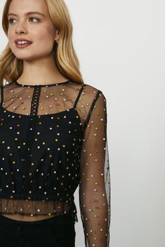 Embroidered Spot Top - Black - The top that promises to get you spotted. Featuring a rainbow of embroidered polkadots, it comes complete with a high neck, long sleeves and cropped ruffle hem. Latest Tops, A Rainbow, Ruffle Hem, The Top, High Neck, Polka Dots, Long Sleeves, Rainbow, Long Sleeve