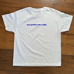 'too pretty for a job' Baby Tee Too Pretty For A Job Graphic Baby Tee, Heavy Cotton, Iconic Slogan T-shirt, 90s Aesthetic Vintage Tee Trending Print Top  - 90's Baby tee style (made for adults) - 100% cotton - Classic fit - Runs true to size (refer to size chart) - Tear-away label - Y2K Vintage Streetwear Trending Fashion - Environmentally sustainable made-to-order system Baby tee's were popularised in the '90s, characterised by it's very short sleeves and slightly cropped body, creating a very 90s Slogan Cotton T-shirt, 90s Short Sleeve T-shirt With Funny Text, 90s Style Crew Neck T-shirt With Funny Text, 90s Style Cotton T-shirt With Funny Text, T-shirt Prints, Baby Tees Aesthetic, 90s Aesthetic Vintage, Baby Tees 90s, Silly Shirt