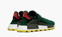 The NERD x Pharrell x adidas NMD Hu “BBC Exclusive” is another important addition to the ongoing legacy of Pharrell Williams’ partnership with adidas.  This NMD Hu once again showcases Pharrell's supergroup, NERD.  With a dark green mesh upper, the “N*E*R*D” logo pops in yellow across the top of each foot.  The rubber outsole is done in a matching yellow.  Red heel tabs and  olive green on the cages add the final touches.  The NERD x Pharrell x adidas NMD Hu “BBC Exclusive” released only at the Nerd Shoes, Adidas Shoes Nmd, Dunk Low Nike, Modern Punk, Punk Clothing, Stadium Goods, Human Race, Punk Outfits, Adidas Nmd