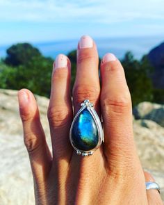 ✨ Labradorite  Gemstone Mystic Ring ✨ Custom Labradorite Gemstone Teardrop Ring. Made with Recycled .925 Sterling Silver.   Mystical Gemstone Jewelry for Men and Women  Bohemian. Statement piece. One of a Kind. Unique. Made just for you!   Handmade in my studio with recycled .925 sterling silver. Featuring a Stunning Labradorite gemstone on a wide silver band.  ✨ Made with Love & Care!  Made to order. Please allow 7 days for production.  Gemstones will vary slightly in size as each is unique.  T Wide Silver Band, Woman Jewelry, Teardrop Ring, Local Jewelry, Silver Band, Sterling Silber, 925 Sterling Silver Ring, Sterling Silver Ring, Jewelry Stores