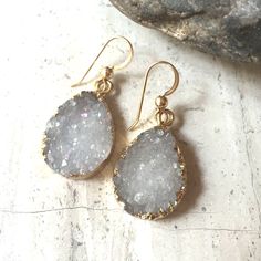 Simple, And Sparkly This Pair Of Druzy Earrings Will Match Almost Any Outfit. They Can Be Dressed Up Or Down. The Natural Rough Crystals Come In Cool-Tone Shades Of Grey With A Slight Iridescence, And Have A Gold-Fill Edge, Which In Some Spots Is Visible From The Front. 14k Gold Over Sterling Ear Hooks. Approx. Size: 5/8"W, 1"L *Each Stone Is Slightly Different And Pairs Are Matched As Best As Possible. Druzy Earrings, Rough Crystal, Ear Hook, Cool Tones, Shades Of Grey, Clay Jewelry, Druzy, Brown And Grey, Gold Filled