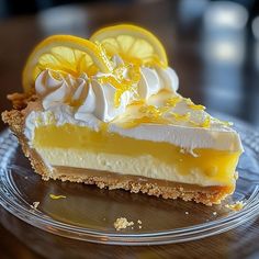 a slice of lemon pie on a clear plate